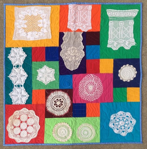 quilt made with doilies